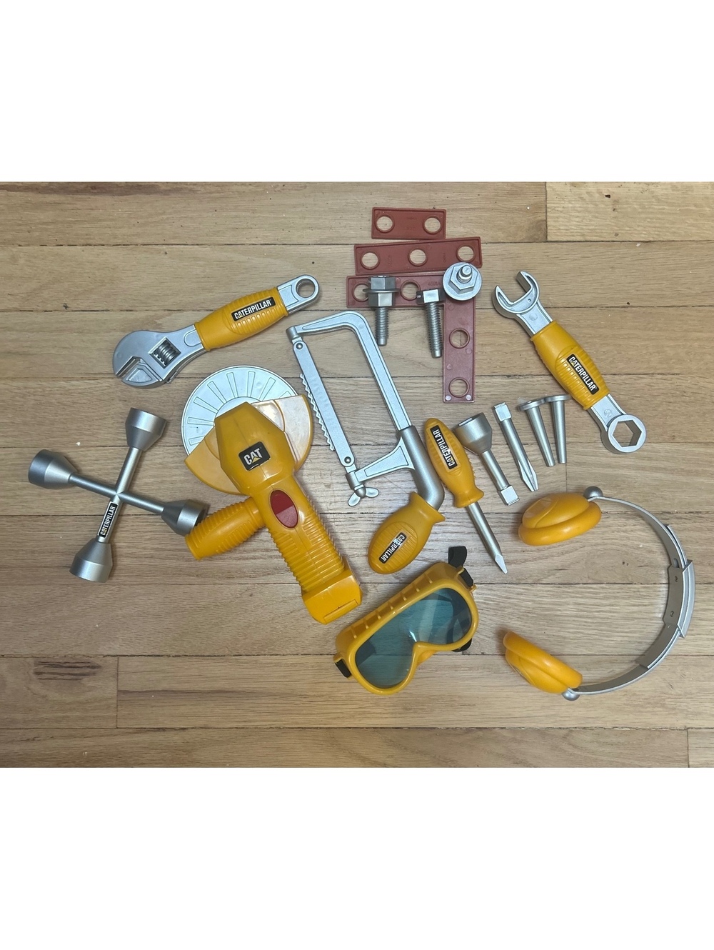 CAT Kids Construction Tool Set with Light-Up Moving Circular Saw, Safety Goggles